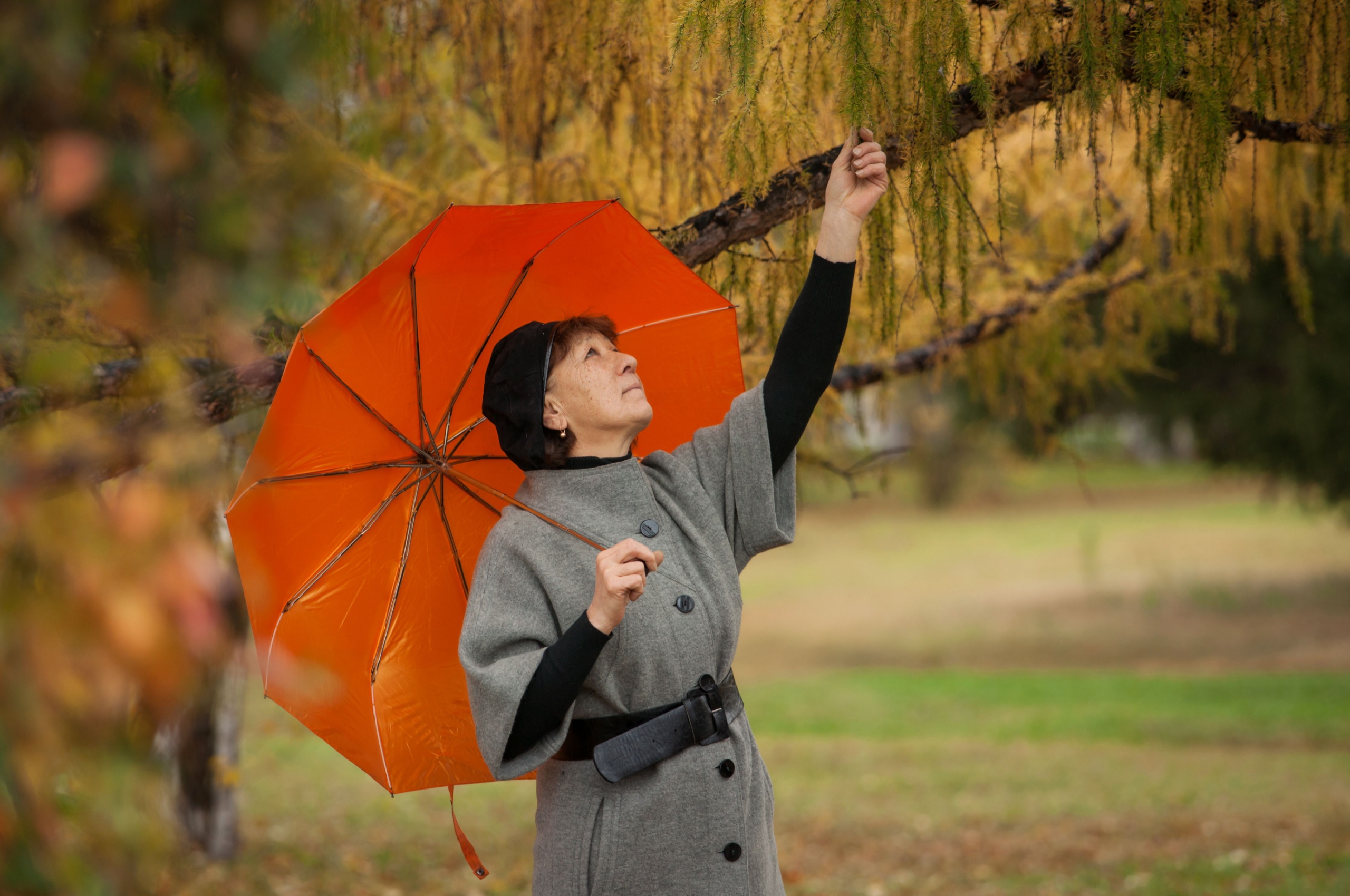 A woman under an umbrella.