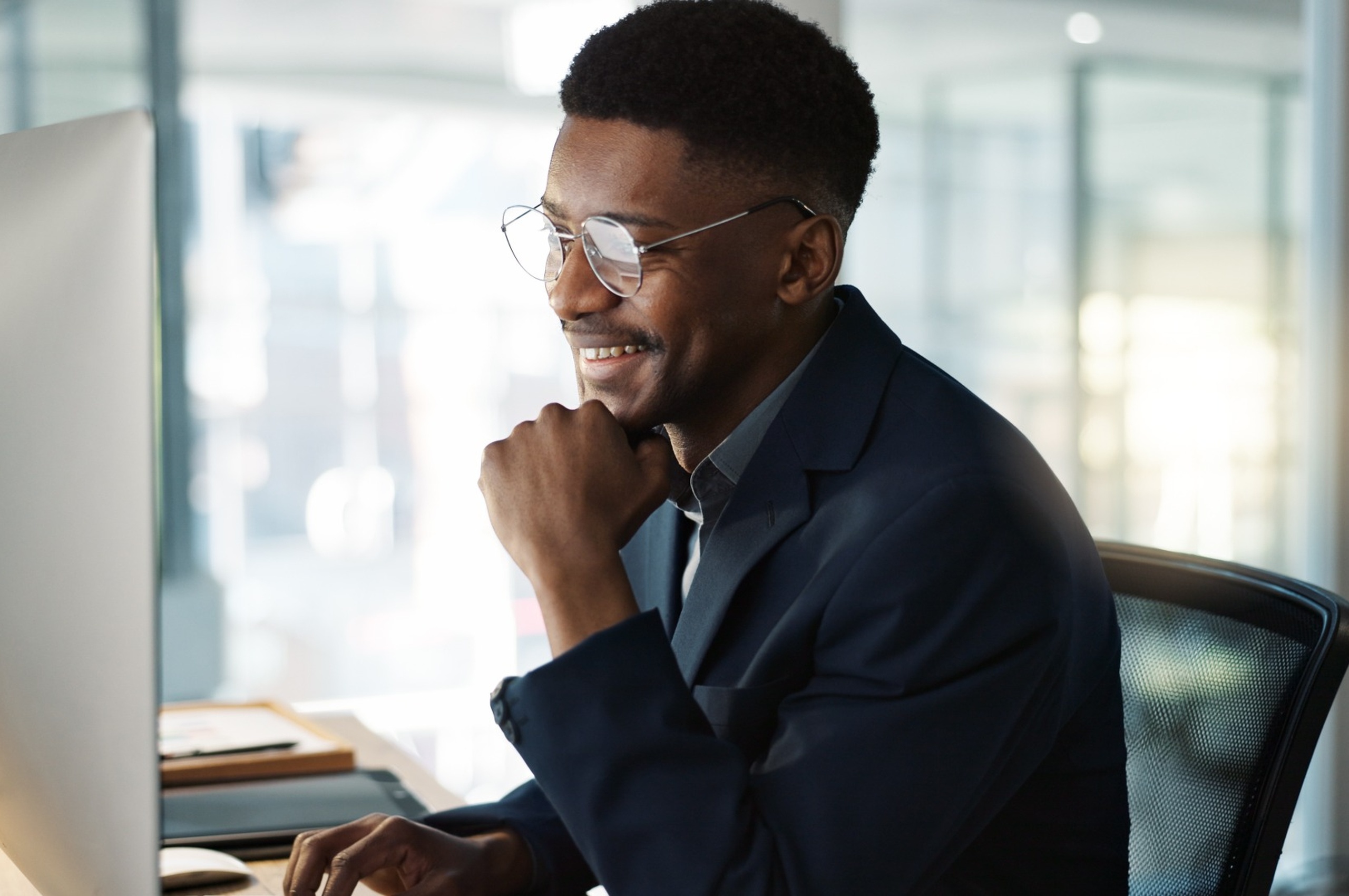 A man working at a computer.
