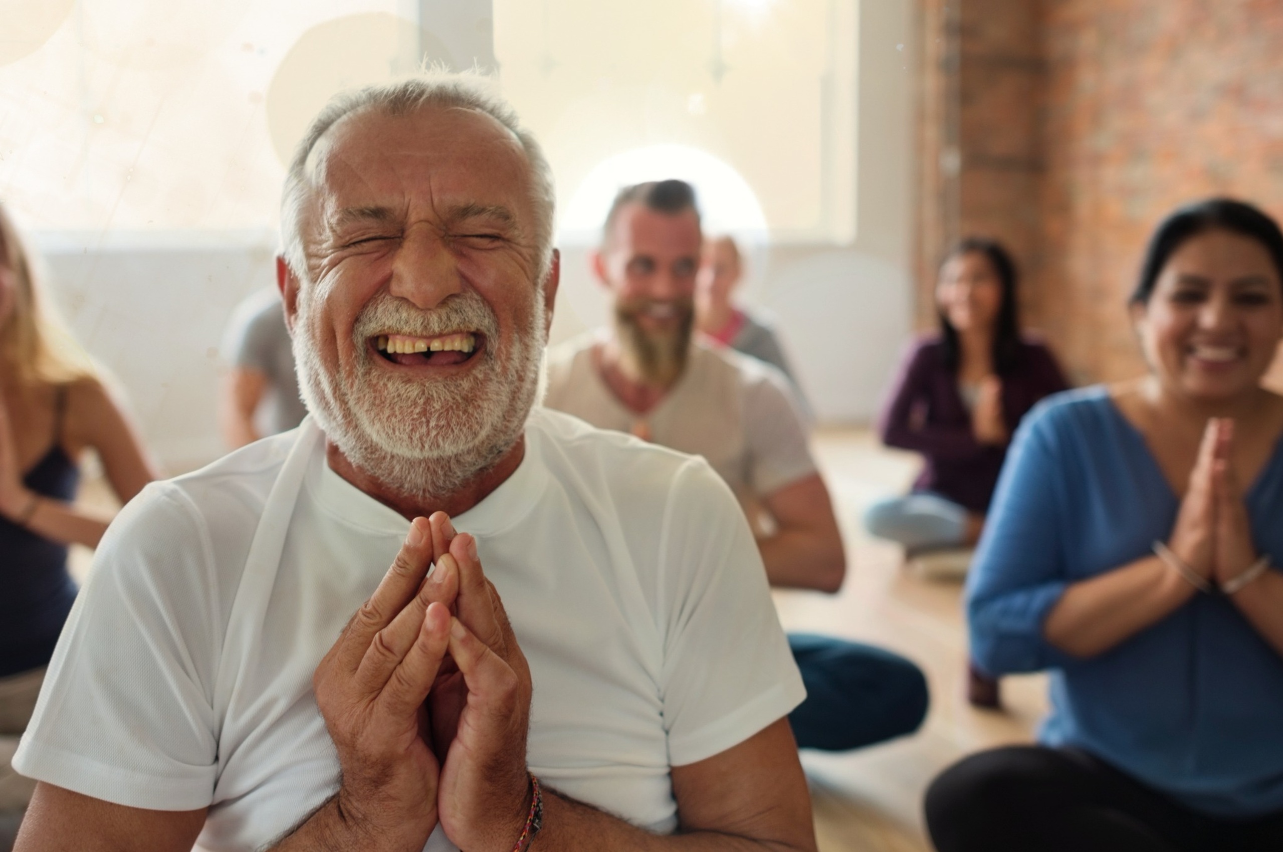 A group of people meditating.
