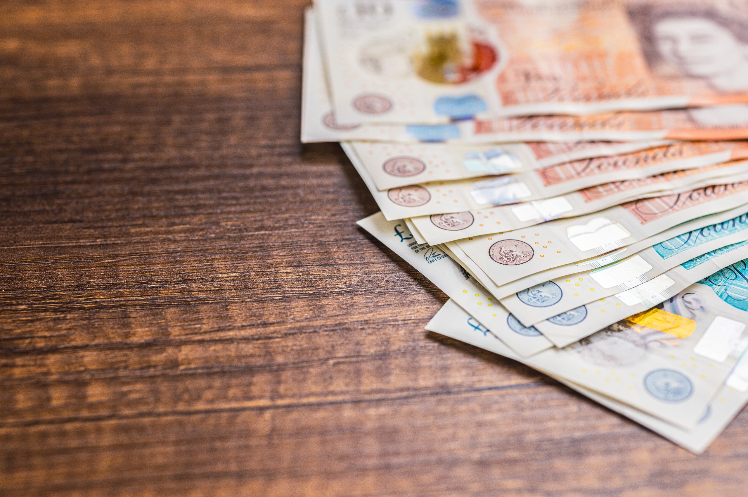 UK bank notes on a table.