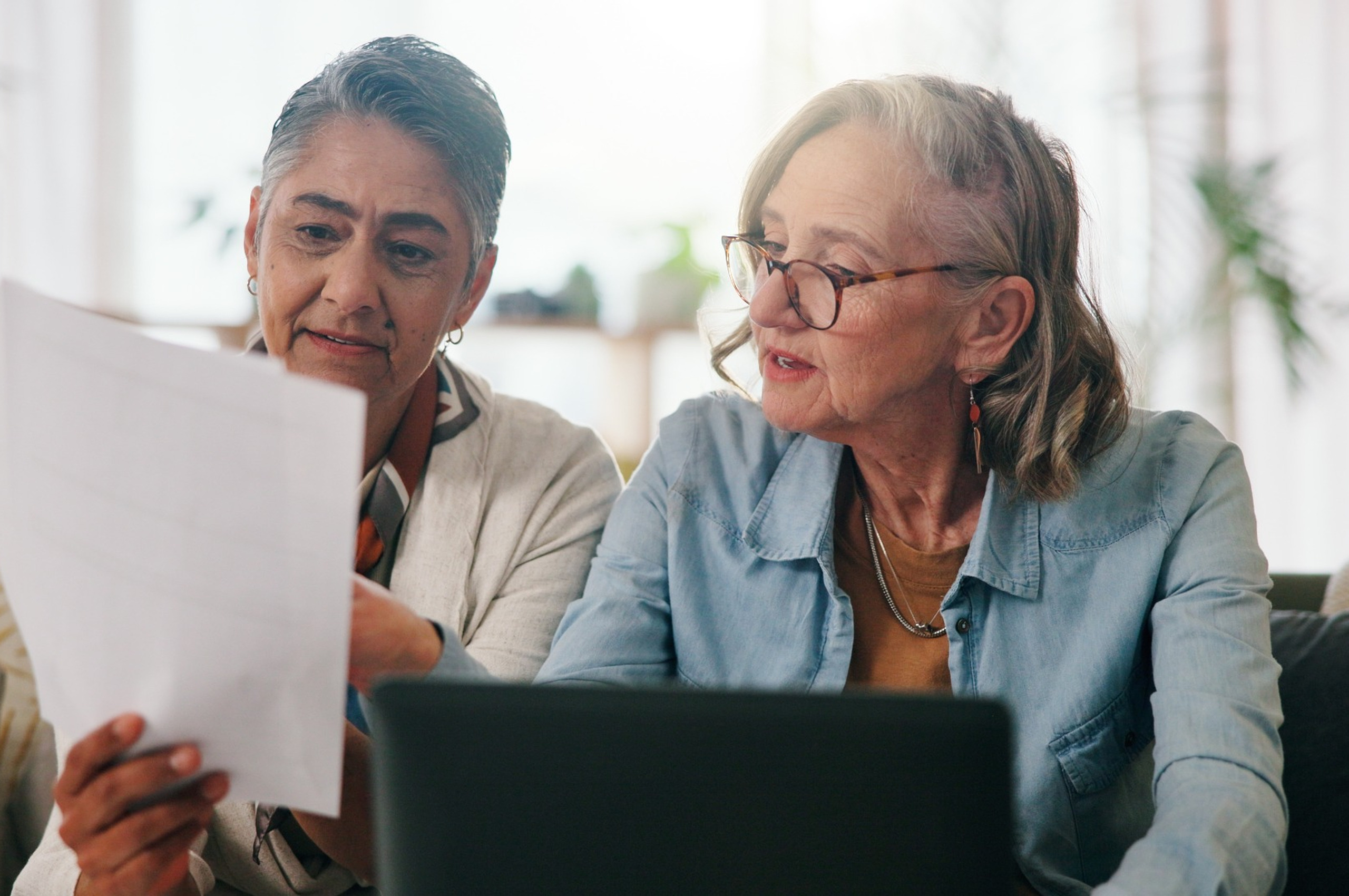 A couple reviewing paperwork together.